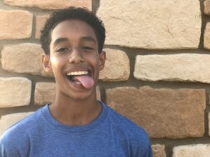 teen boy smiling after braces removal